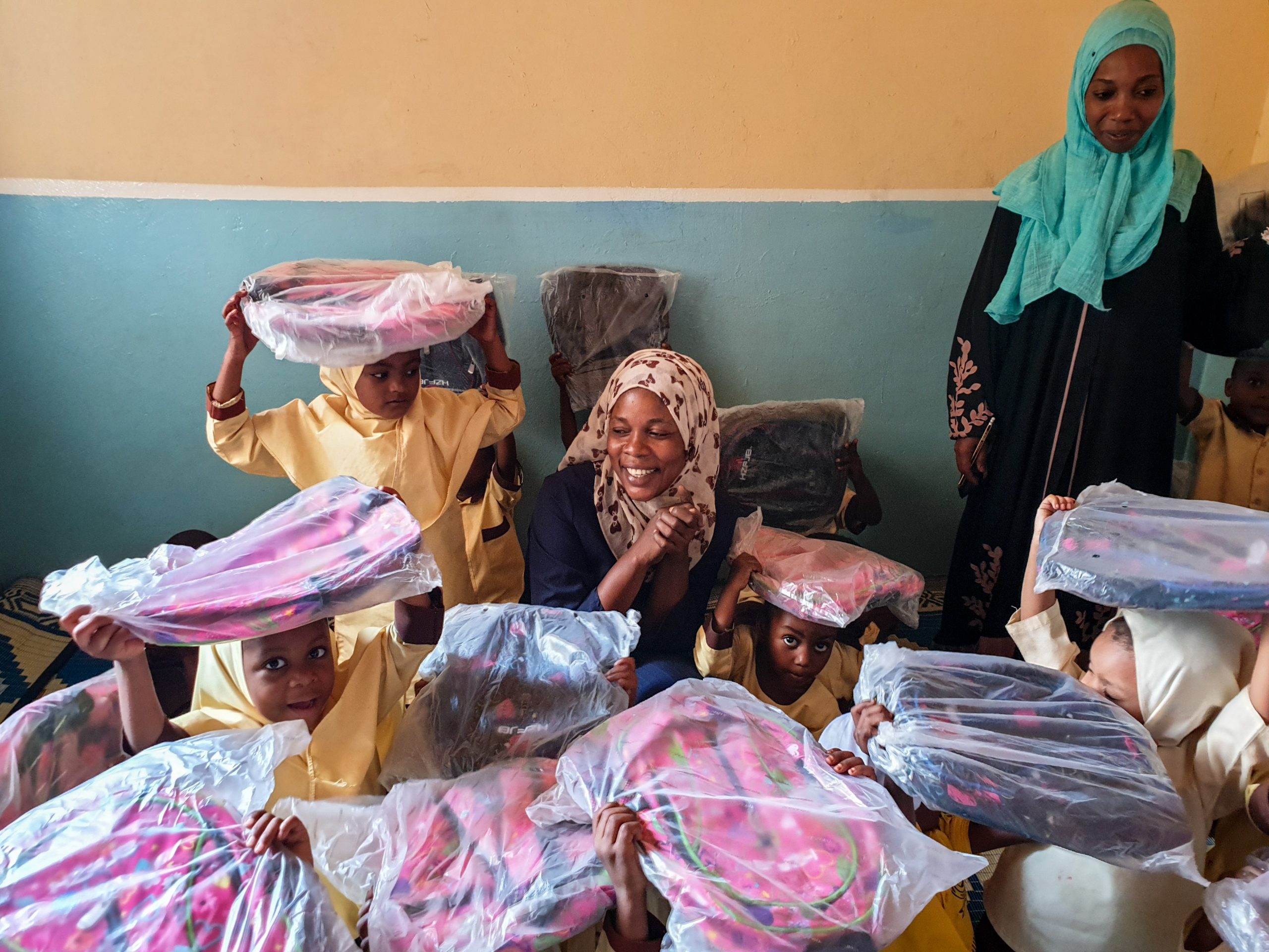_giving school supplies to students