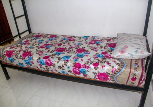 Bed with floral bedcovers