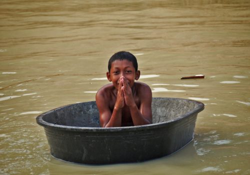 Boy on self-made ship in the pond(1)