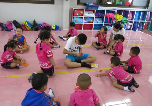 Participant teaching kids how to make handicraft(3)