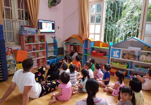 Participant watching cartoon with kids