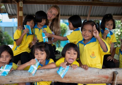 Participant with students during break time