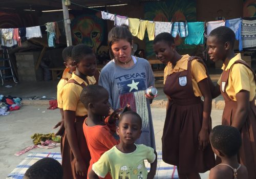 Participant with students outside the classroom