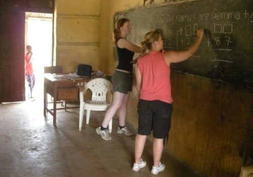 Participants writing on a chalkboard