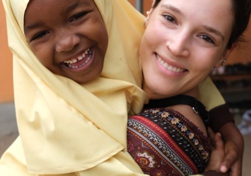 Student and participant smiling on camera