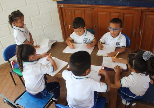 Students sit on their desk