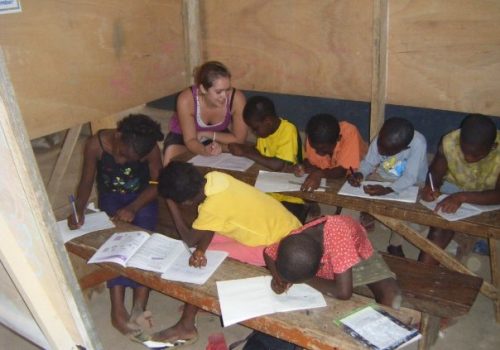 Students writing on their books
