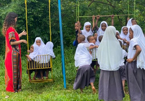 _participant with the students on swing